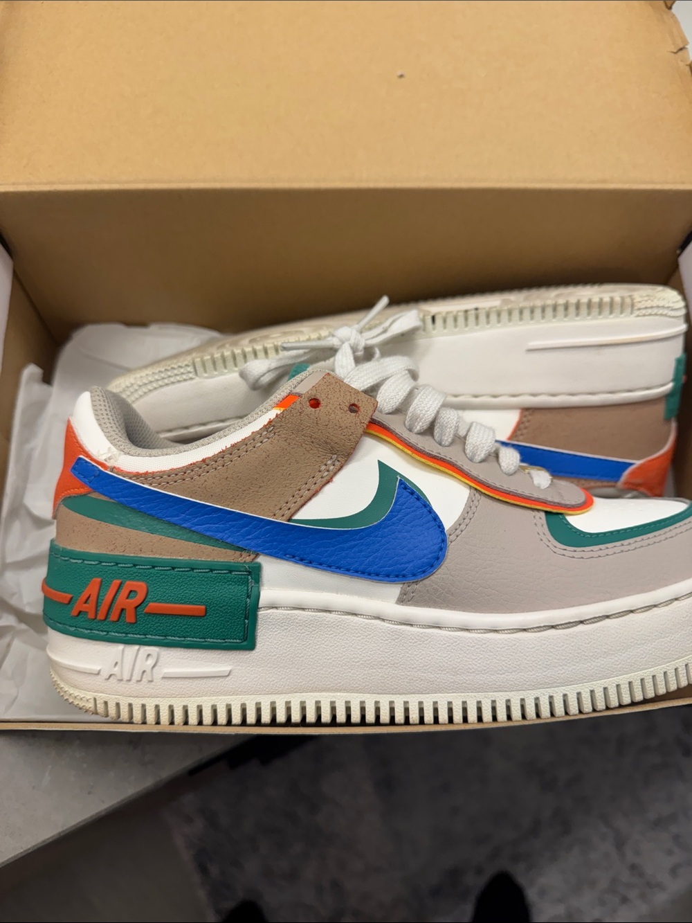 Nike Low-Top Sneakers with Blue Swoosh and Green Accents